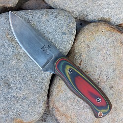 Knife 304 - San Mai drop point with a 1095 core and 80CRV2 steel outer cladding. The scales are crafted from Contra  G-10. The knife features jimping on the spine, copper mosaic pins and a copper lanyard hole. The leather lined kydex sheath is included and is set up for both vertical and horizontal carry. $425.00 + $10.00 shipping and handling